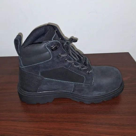 A pair of mens black Wolverine Steel Toe work boots NWOB in a size 8M.