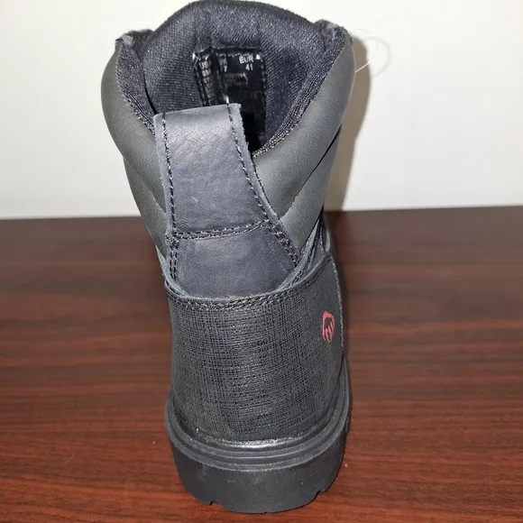 A pair of mens black Wolverine Steel Toe work boots NWOB in a size 8M.