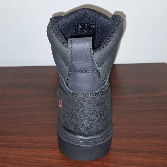 A pair of mens black Wolverine Steel Toe work boots NWOB in a size 8M.