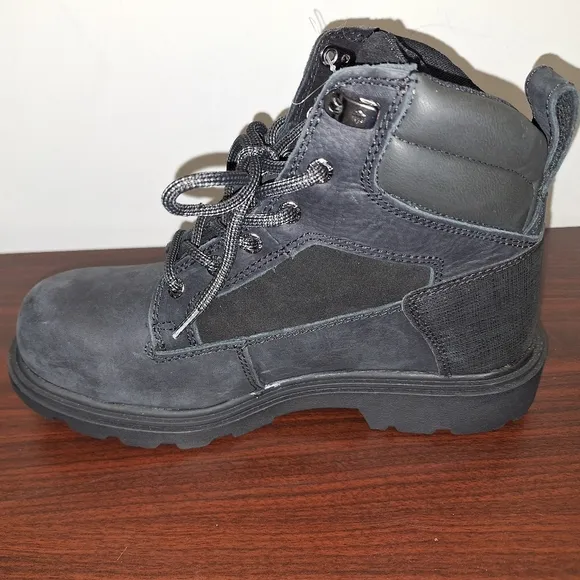 A pair of mens black Wolverine Steel Toe work boots NWOB in a size 8M.