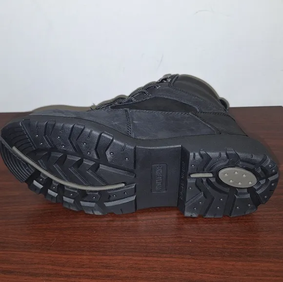 A pair of mens black Wolverine Steel Toe work boots NWOB in a size 8M.