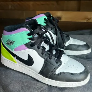 Air Jordan Neon Black and White High-Top Sneakers with Color Blocking Design