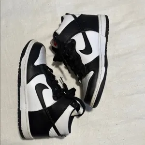 Black and White High-Top Nike Dunks Sneakers