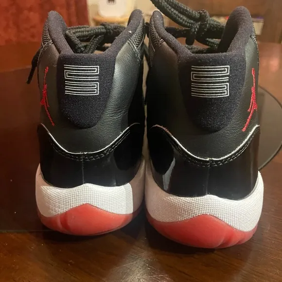 Jordan 11 Black and Red Sneakers with Patent Leather