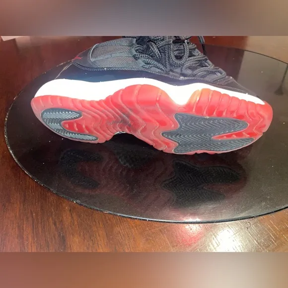 Jordan 11 Black and Red Sneakers with Patent Leather
