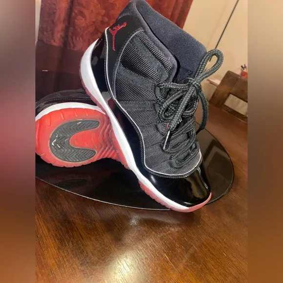 Jordan 11 Black and Red Sneakers with Patent Leather