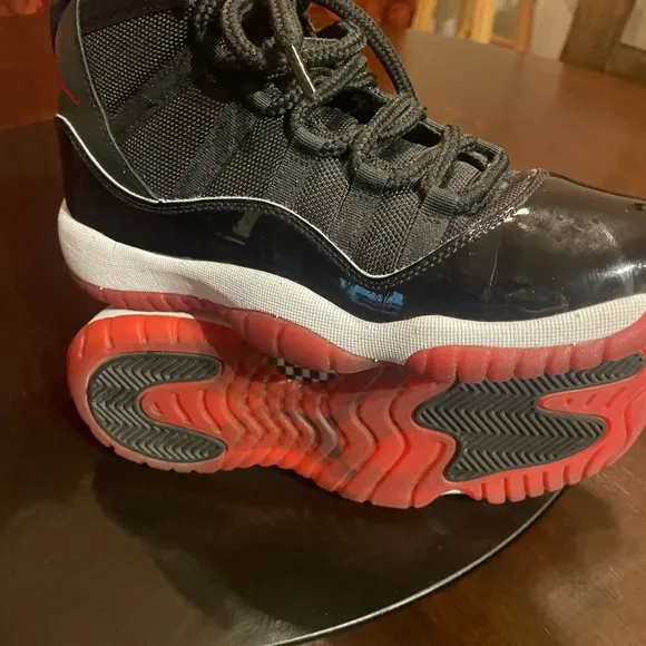 Jordan 11 Black and Red Sneakers with Patent Leather