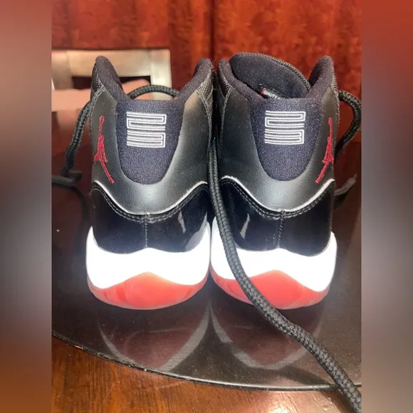 Jordan 11 Black and Red Sneakers with Patent Leather