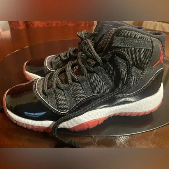 Jordan 11 Black and Red Sneakers with Patent Leather