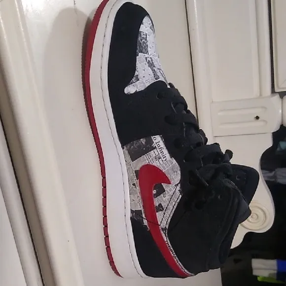Jordan 1s Newspaper Black and Red High-Top Sneakers