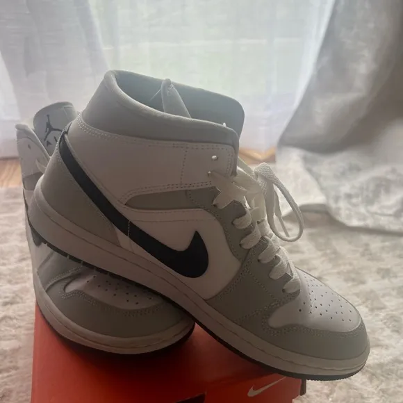 Jordan White and Gray Athletic Shoes with Iconic Design