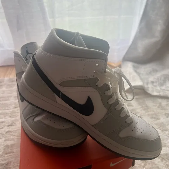 Jordan White and Gray Athletic Shoes with Iconic Design
