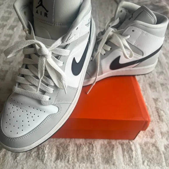 Jordan White and Gray Athletic Shoes with Iconic Design