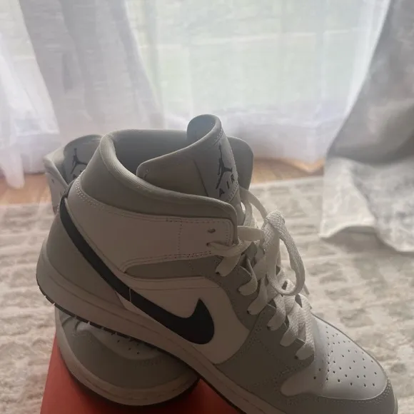 Jordan White and Gray Athletic Shoes with Iconic Design