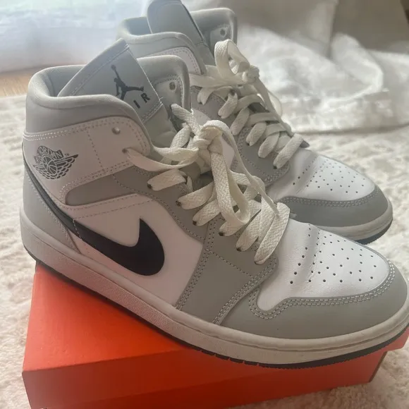 Jordan White and Gray Athletic Shoes with Iconic Design