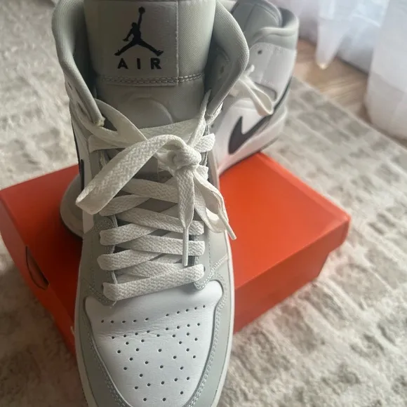 Jordan White and Gray Athletic Shoes with Iconic Design