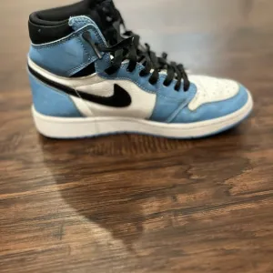Nike Air Jordan 1 High Blue and Black Sneakers
