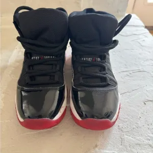 Nike Air Jordan Black and Red High-Top Sneakers with Patent Leather