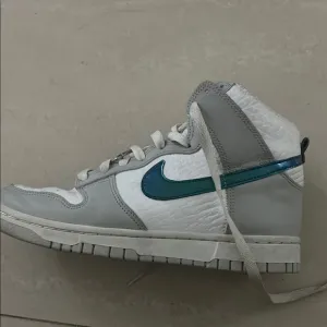Nike High-Top Sneakers with Blue Swoosh