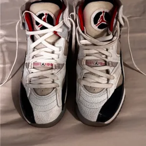 Nike Jumpman White and Black High-Top Sneakers