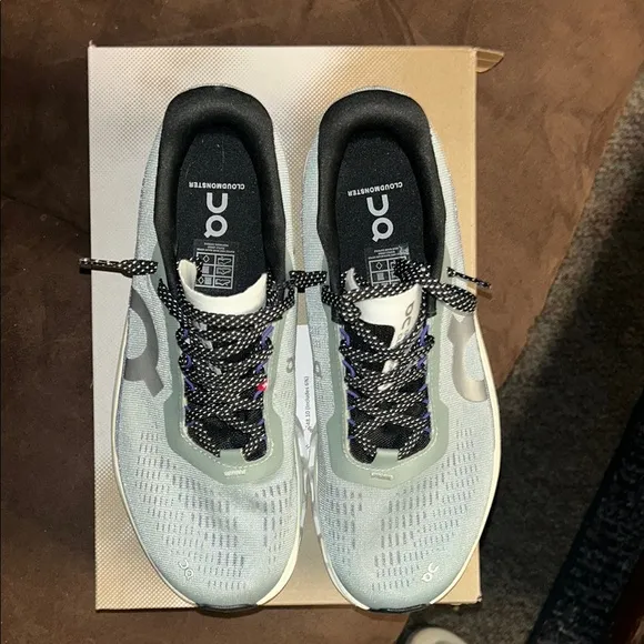 On Running Green and Blue Athletic Shoes with CloudTec Technology