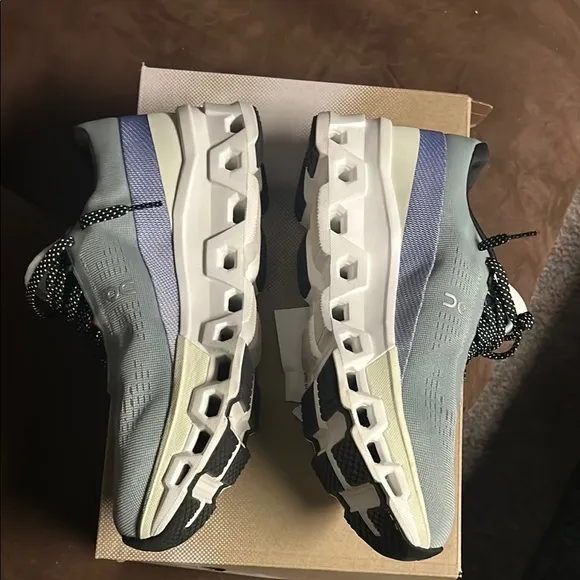On Running Green and Blue Athletic Shoes with CloudTec Technology