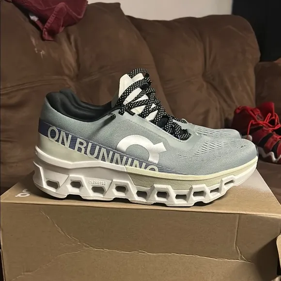 On Running Green and Blue Athletic Shoes with CloudTec Technology
