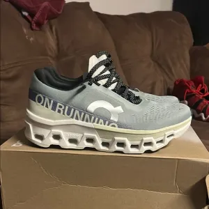 On Running Green and Blue Athletic Shoes with CloudTec Technology