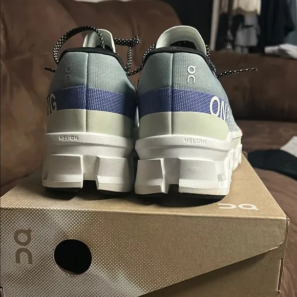 On Running Green and Blue Athletic Shoes with CloudTec Technology