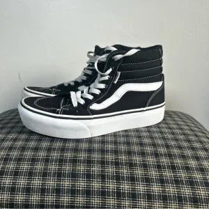 Vans Black and White High-Top Sneakers